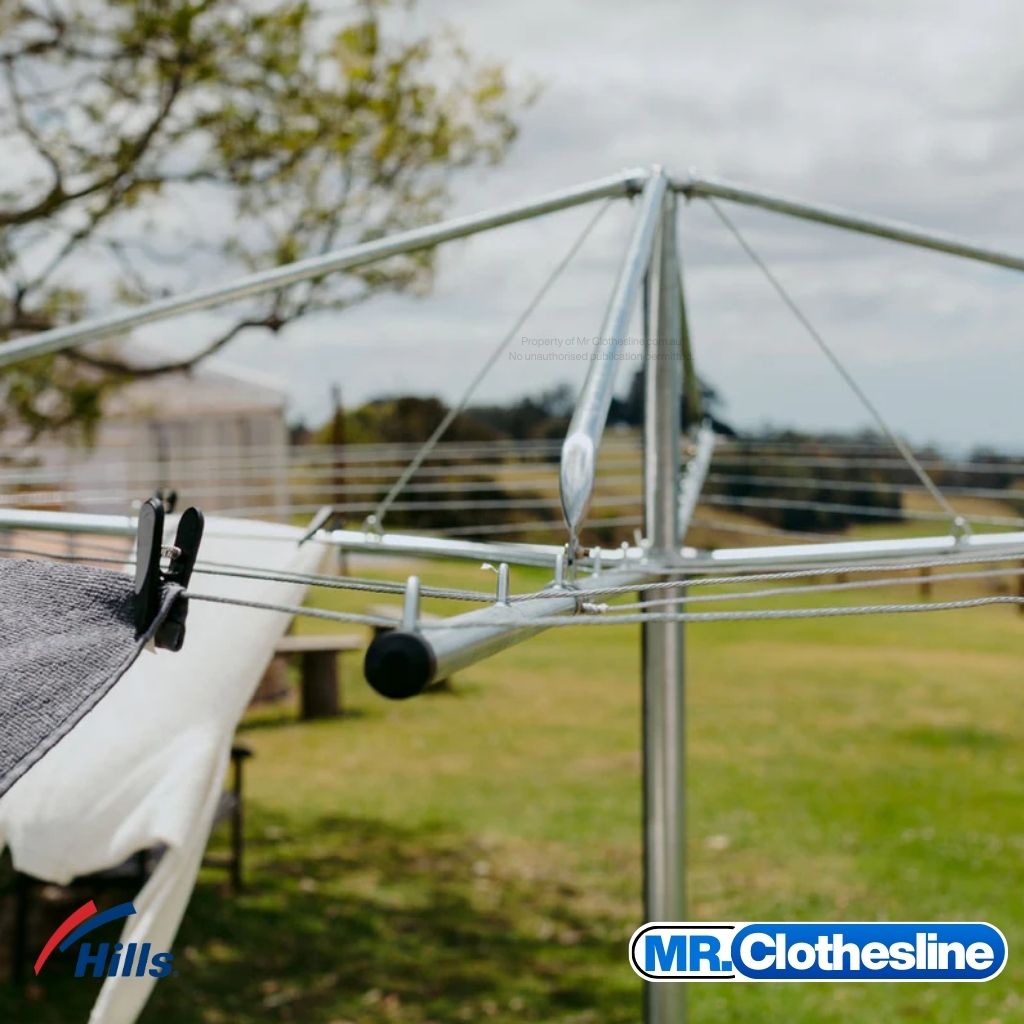 Hills Fixed Head Rotary Clothesline 7 Line close up of the clothesline arm with washing pegged to the wire lines.