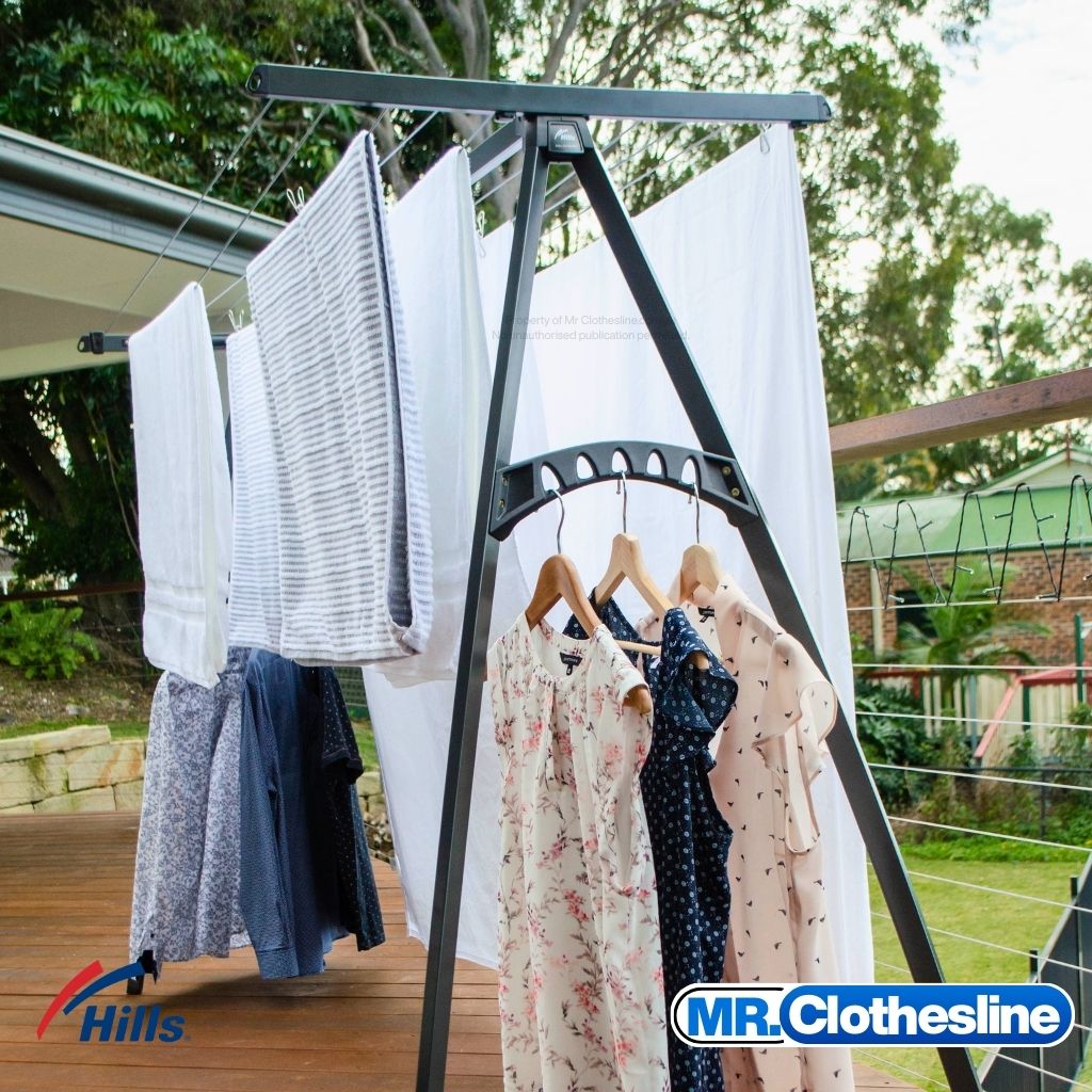 Frontview of the Hills Portable Clothesline on deck with a full load of washing.