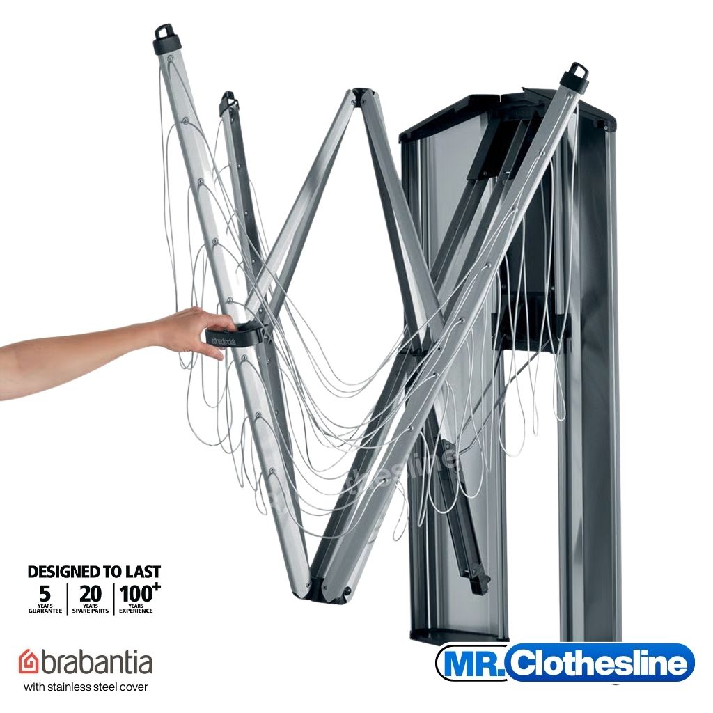 Wall fix clothesline being opened with one hand. Stainless steel cover hasd been opened. 