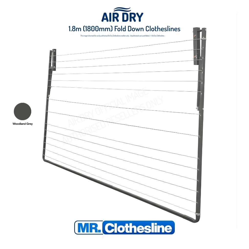 Air Dry Fold Down Clothesline folded flat agains a white wall.