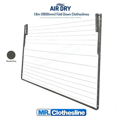 Air Dry Fold Down Clothesline folded flat agains a white wall.