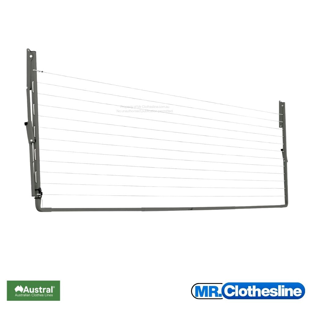 Austral Compact 39 Fold  Down Clothesline front view and the clothesline closed flat against a white wall. Colour Woodland Grey.