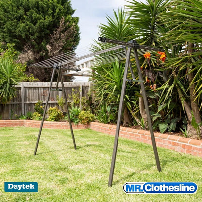 Daytek Portable Clothesline, in a backyard with Yakkas in the garden bed.