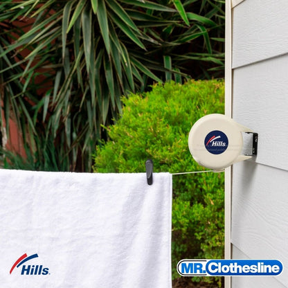 Hills Cordomatic Retractable Clothesline installed outside with washing pegged on the line