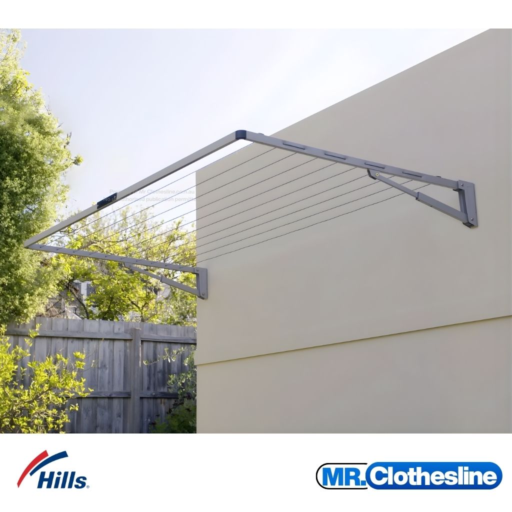 Hills Everyday Single Fold Down Clothesline, installed on a wall outside.