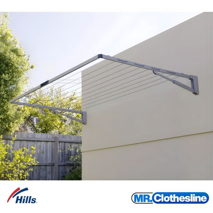 Hills Everyday Single Fold Down Clothesline, installed on a wall outside.