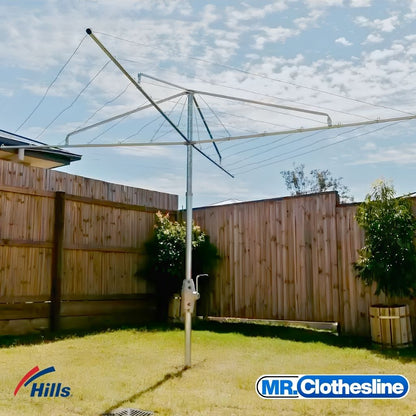 Hills Fixed Head Rotary Clothesline 6 Lines Installed in an Australian Backyard timber fence in the background.