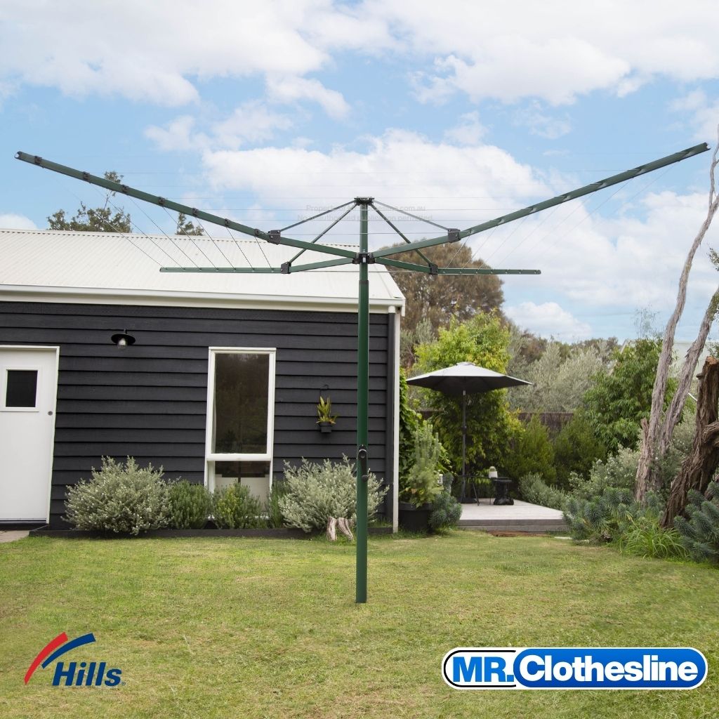 Hills Everyday Folding Rotary 7 Line Fully Open in a garden setting with a brown shed.